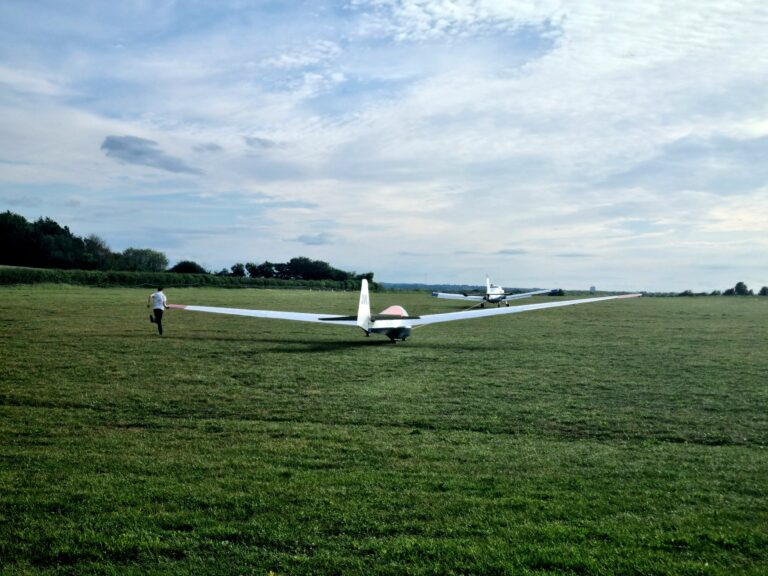 Running the wing as the glider starts to roll behind the tow-plane