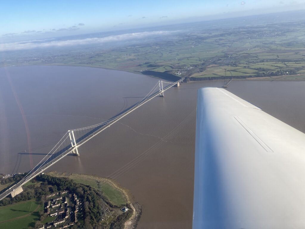 Glider flying over the Severn Bridge